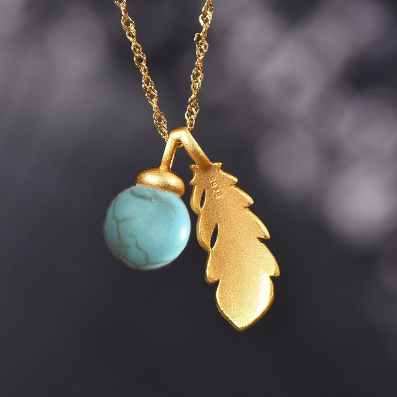 Collar con colgante de plumas  - Bar Cart Gold reseña y precio